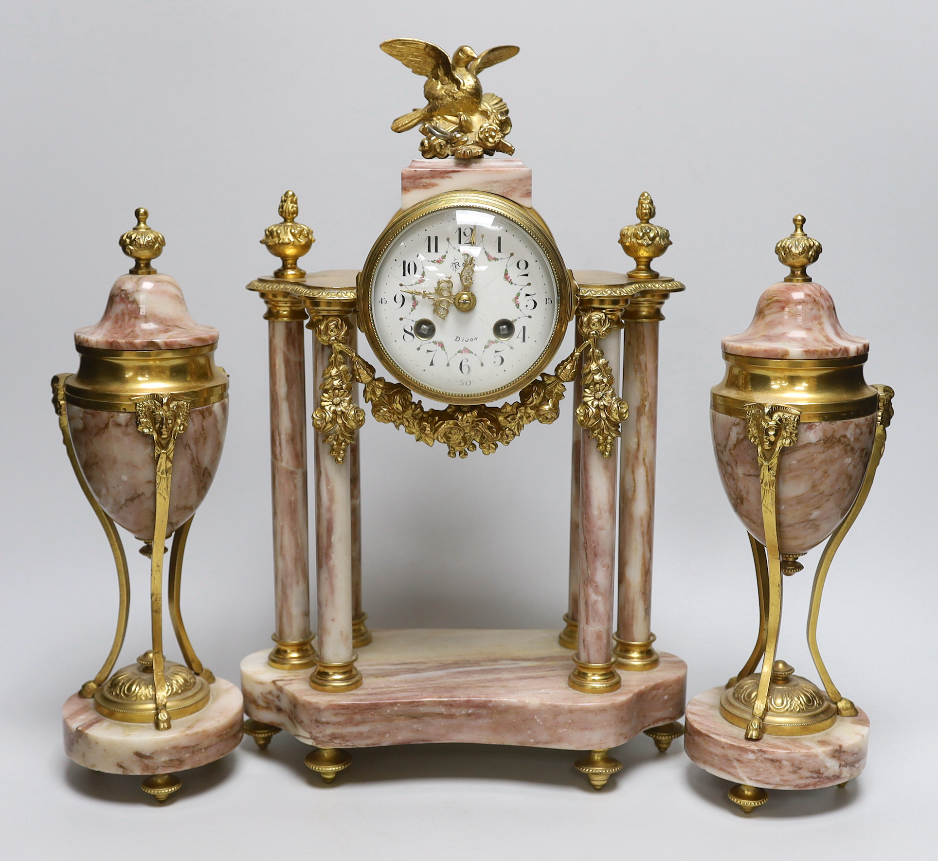 An early 20th century French gilt-metal and marble clock garniture, 38cm high